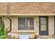 Close-up of the exterior showing the front door and window with brick detail at 12931 W 20Th Ave, Golden, CO 80401