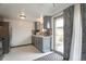 Functional kitchen with grey cabinets, stainless appliances, and sliding glass door at 12931 W 20Th Ave, Golden, CO 80401