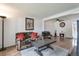 Cozy living room featuring a fireplace, hardwood floors, and comfortable seating at 12931 W 20Th Ave, Golden, CO 80401