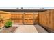 This private patio has a wood fence for seclusion and a planter for small garden at 12931 W 20Th Ave, Golden, CO 80401