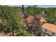 Aerial view of a well-maintained property with mature trees and a charming brick home at 3764 Newton St, Denver, CO 80211