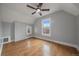 Bedroom with hardwood floors, and ample natural light from two windows at 3764 Newton St, Denver, CO 80211