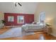 Spacious main bedroom with hardwood floors, a cozy bed, and plenty of natural light at 3764 Newton St, Denver, CO 80211
