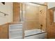 The bathroom features a tiled shower with glass door and built in shelves at 2400 N Broadway # 4, Denver, CO 80205