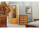Bedroom with wooden dresser, interior door and decor at 2400 N Broadway # 4, Denver, CO 80205