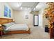 Bedroom with a bed, decorative artwork, and exposed piping at 2400 N Broadway # 4, Denver, CO 80205