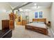 Comfortable bedroom with a queen bed, dresser, and unique light fixtures at 2400 N Broadway # 4, Denver, CO 80205