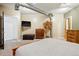 Bedroom with an ottoman, television, and dresser at 2400 N Broadway # 4, Denver, CO 80205