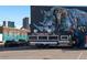 Eye-catching food truck with a vibrant rhino mural backdrop in city at 2400 N Broadway # 4, Denver, CO 80205
