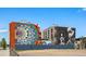 Building exterior with two murals, on a sunny day at 2400 N Broadway # 4, Denver, CO 80205