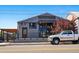 Yardbird Restaurant exterior with modern gray facade and truck parked nearby at 2400 N Broadway # 4, Denver, CO 80205