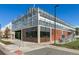 Modern commercial building with greenhouse-style glass facade and brick accents at 2400 N Broadway # 4, Denver, CO 80205