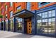 Building exterior with a wood door, blue frame, and gold lettering at 2400 N Broadway # 4, Denver, CO 80205