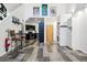 Open floor plan connecting living space, kitchen, and laundry areas with movie posters at 2400 N Broadway # 4, Denver, CO 80205