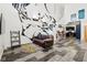 Stylish living room featuring wood floors, modern decor, and a grand mural on the wall at 2400 N Broadway # 4, Denver, CO 80205
