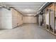 Spacious unfinished basement with concrete floor provides a blank canvas for future expansion at 5779 Piney River Pl, Brighton, CO 80601