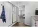 The tiled bathroom features a glass door shower and an entrance to the main bedroom at 5779 Piney River Pl, Brighton, CO 80601