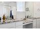 Elegant bathroom showcasing dual sinks with granite countertops, a glass-enclosed shower, and ample lighting at 5779 Piney River Pl, Brighton, CO 80601