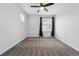 Bedroom features soft carpet, neutral paint, a ceiling fan, and natural light at 5779 Piney River Pl, Brighton, CO 80601