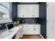 Stylish home office with white cabinets, desk space, and a window for natural light at 5779 Piney River Pl, Brighton, CO 80601