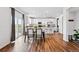 Modern kitchen and dining area with stainless appliances and sliding glass door to the backyard at 5779 Piney River Pl, Brighton, CO 80601