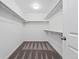 Spacious walk-in closet featuring carpet and ample shelving and hanging space at 5779 Piney River Pl, Brighton, CO 80601