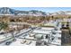 Aerial view of townhomes with rooftop hot tubs, offering mountain views and snowy landscape at 2471 Walnut St, Boulder, CO 80302