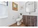 Modern bathroom with wood vanity and a frameless mirror at 2471 Walnut St, Boulder, CO 80302