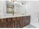 Double vanity bathroom with modern wood cabinets and a large mirror at 2471 Walnut St, Boulder, CO 80302