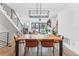 Bright dining room with a large wooden table and modern chandelier at 2471 Walnut St, Boulder, CO 80302