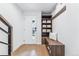 Bright entryway with built-in bench, shelves, and wood floors at 2471 Walnut St, Boulder, CO 80302