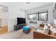 Cozy Gathering room with a leather sofa and large TV at 2471 Walnut St, Boulder, CO 80302