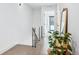 Modern hallway with light wood floors and a sleek metal railing at 2471 Walnut St, Boulder, CO 80302