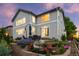 The backyard has a well-maintained garden, patio furniture, beautiful landscaping, and a sculpture at 5984 S Paris Pl, Greenwood Village, CO 80111