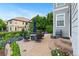A lovely stone patio with outdoor seating and a grill create an ideal space for entertaining and relaxation at 5984 S Paris Pl, Greenwood Village, CO 80111