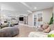 Spacious basement featuring a recreational space, built-in bookshelves, and a separate office area at 5984 S Paris Pl, Greenwood Village, CO 80111