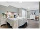 Comfortable bedroom featuring a queen bed, soft lighting, and closet doors at 5984 S Paris Pl, Greenwood Village, CO 80111