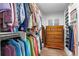 Walk-in closet with custom shelving and hanging space for clothes and accessories at 5984 S Paris Pl, Greenwood Village, CO 80111