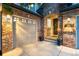 Charming brick home featuring an attached two-car garage and a welcoming front entrance at 5984 S Paris Pl, Greenwood Village, CO 80111
