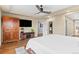 Bedroom features hardwood floors, a ceiling fan, a TV and a large closet at 5984 S Paris Pl, Greenwood Village, CO 80111