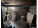 Unfinished basement featuring exposed utilities, concrete walls, and storage capacity at 1000 Denver Ave, Fort Lupton, CO 80621