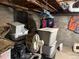 Unfinished basement storage area with concrete walls and visible ceiling beams at 1000 Denver Ave, Fort Lupton, CO 80621