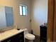 Bathroom features a new vanity, toilet, mirror and medicine cabinet at 1000 Denver Ave, Fort Lupton, CO 80621