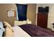 Bedroom with dark brown color scheme and laminate flooring at 1000 Denver Ave, Fort Lupton, CO 80621