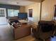 Comfortable living room with wood flooring and ample seating area at 1000 Denver Ave, Fort Lupton, CO 80621