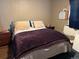 Bedroom with dark brown color scheme and laminate flooring at 1000 Denver Ave, Fort Lupton, CO 80621