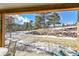 Peaceful backyard with mountain views and snowy landscape at 31819 Rocky Village Dr # 216, Evergreen, CO 80439