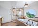 Bright bathroom with stand alone tub and a scenic view at 33448 Alta Vista Dr, Evergreen, CO 80439