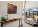 Bright bedroom boasts large windows and a private balcony with stunning views at 33448 Alta Vista Dr, Evergreen, CO 80439