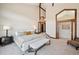 Bright bedroom features a vaulted ceiling with exposed beams and unique architectural details at 33448 Alta Vista Dr, Evergreen, CO 80439